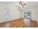Primary bedroom features a sliding door leading to the pool area and hardwood floors at 1624 Shady Leaf Dr, Valrico, FL 33596