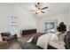 Virtually staged primary bedroom features a stylish rug and access to patio at 1624 Shady Leaf Dr, Valrico, FL 33596