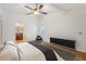 Virtually staged primary bedroom with attached bathroom and hardwood floors at 1624 Shady Leaf Dr, Valrico, FL 33596