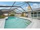 Inviting screened-in pool with a spa and plenty of room to relax and enjoy the sunshine at 1624 Shady Leaf Dr, Valrico, FL 33596