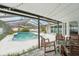 Refreshing screened-in pool with plenty of space to relax with comfortable seating under a covered patio at 1624 Shady Leaf Dr, Valrico, FL 33596