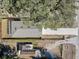 Overhead view of the property highlighting the house, roof, driveway, and surrounding greenery at 16519 Us Highway 41, Spring Hill, FL 34610