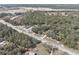 Expansive property with surrounding greenery and road access, offering development opportunities at 16519 Us Highway 41, Spring Hill, FL 34610