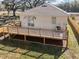 Elevated view of a large wooden deck attached to a house with fencing on all sides at 16519 Us Highway 41, Spring Hill, FL 34610