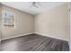 This bedroom features modern flooring, and a sunlit window at 16519 Us Highway 41, Spring Hill, FL 34610