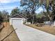 Charming single-Gathering home with a two-car garage and a long concrete driveway at 16519 Us Highway 41, Spring Hill, FL 34610