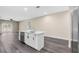 Open-concept kitchen with a large island, stainless steel dishwasher, and modern finishes with ample space at 16519 Us Highway 41, Spring Hill, FL 34610