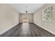 A spacious living room features sliding glass doors leading to a patio and modern ceiling fan at 16519 Us Highway 41, Spring Hill, FL 34610