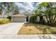 Charming single-story home with lush landscaping and a two-car garage at 2008 Berry Lake Dr, Brandon, FL 33510