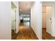 Hallway with wood-look floors leading to the main living areas at 2008 Berry Lake Dr, Brandon, FL 33510