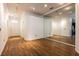 Spacious open-concept living area with wood-look floors and access to the kitchen at 2008 Berry Lake Dr, Brandon, FL 33510