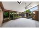 Enclosed porch features wood trim, large windows, and a ceiling fan at 2048 Los Lomas Dr, Clearwater, FL 33763