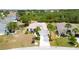 Aerial view of a home in a desirable neighborhood, highlighting its curb appeal and landscaping at 2258 Preservation Green Ct, Sun City Center, FL 33573