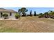 Spacious backyard with mature landscaping and room for outdoor activities at 2258 Preservation Green Ct, Sun City Center, FL 33573