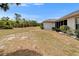 Expansive backyard with mature landscaping and lush shrubbery offering privacy at 2258 Preservation Green Ct, Sun City Center, FL 33573