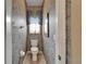Powder room with floral wallpaper and decorative window at 2258 Preservation Green Ct, Sun City Center, FL 33573