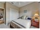 Cozy bedroom with neutral tones, a comfortable bed, and a large closet, perfect for relaxation at 2258 Preservation Green Ct, Sun City Center, FL 33573