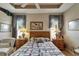 Bedroom with light wood floors, ceiling fan and decorator window treatments at 2258 Preservation Green Ct, Sun City Center, FL 33573