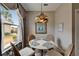 Charming breakfast nook with decorative light fixture and view of the outdoors at 2258 Preservation Green Ct, Sun City Center, FL 33573