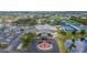 Aerial view of the Sun City Center Community Hall, tennis courts, and surrounding residential area at 2258 Preservation Green Ct, Sun City Center, FL 33573