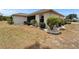 Well-maintained home exterior with beautiful landscaping and manicured garden beds at 2258 Preservation Green Ct, Sun City Center, FL 33573