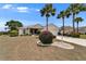Inviting home featuring mature landscaping, a two-car garage and a manicured lawn at 2258 Preservation Green Ct, Sun City Center, FL 33573