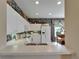 Bright kitchen featuring white cabinetry, ample counter space, and modern appliances at 2258 Preservation Green Ct, Sun City Center, FL 33573