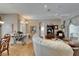 Inviting living room with hardwood floors and seamless transition to the dining space at 2258 Preservation Green Ct, Sun City Center, FL 33573