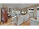 Bright living room with hardwood floors, comfortable sofas, and an open layout, perfect for relaxation and entertaining at 2258 Preservation Green Ct, Sun City Center, FL 33573