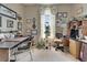 Comfortable home office with dual desks, ample storage, and natural light from a large window at 2258 Preservation Green Ct, Sun City Center, FL 33573