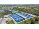 Overhead view of outdoor pickleball courts featuring covered seating and multiple play areas at 2258 Preservation Green Ct, Sun City Center, FL 33573