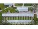 Aerial view of shuffleboard courts with covered seating and palm trees at 2258 Preservation Green Ct, Sun City Center, FL 33573