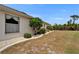 Expansive side yard featuring privacy landscaping and lush shrubbery at 2258 Preservation Green Ct, Sun City Center, FL 33573