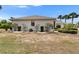 Expansive side yard featuring lush landscaping and mature shrubbery at 2258 Preservation Green Ct, Sun City Center, FL 33573