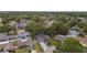Aerial view of neighborhood with mature trees and well kept lawns at 3106 Ash Ct, Dunedin, FL 34698