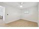 Bedroom features new flooring, baseboards, ceiling fan, and one window at 3106 Ash Ct, Dunedin, FL 34698