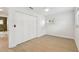 Bedroom with wood floors, closet with folding doors, and window at 3106 Ash Ct, Dunedin, FL 34698
