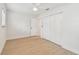 Bright bedroom with wood floors, a ceiling fan and closet with folding doors at 3106 Ash Ct, Dunedin, FL 34698