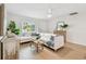 Bright living room with a comfortable seating area and wood floors at 3106 Ash Ct, Dunedin, FL 34698