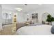 Inviting main bedroom features a dressing area, ensuite bath, and plenty of natural light at 3106 Ash Ct, Dunedin, FL 34698