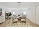 Inviting and airy main bedroom featuring a neutral color palette, updated flooring, and ample natural light at 3106 Ash Ct, Dunedin, FL 34698