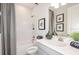 Clean bathroom with a tub and shower combo, vanity, and neutral finishes at 33284 Castaway Loop, Wesley Chapel, FL 33543