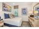 Bedroom with unique dresser, stylish accents, window, and plush carpet at 33284 Castaway Loop, Wesley Chapel, FL 33543