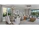 Inviting living room with a dining area, contemporary furnishings, and plenty of natural light at 33284 Castaway Loop, Wesley Chapel, FL 33543