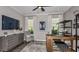 Functional home office with a comfortable chair, desk, and custom shelving at 33284 Castaway Loop, Wesley Chapel, FL 33543