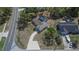 Aerial view of the home showing pool, driveway, and neighborhood at 3344 Blythe Ave, Spring Hill, FL 34609