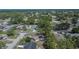 A high aerial view of a home in a wooded neighborhood at 3344 Blythe Ave, Spring Hill, FL 34609