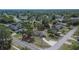 This aerial perspective features a house with a pool in a neighborhood, offering a glimpse of community charm and greenery at 3344 Blythe Ave, Spring Hill, FL 34609