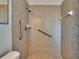 Shower with safety bars and modern tile work at 3344 Blythe Ave, Spring Hill, FL 34609