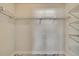 Spacious closet with shelving and lovely marble floors to match the bedroom at 3344 Blythe Ave, Spring Hill, FL 34609